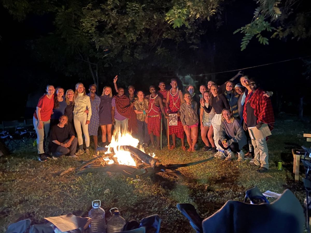 The group around a campfire at night