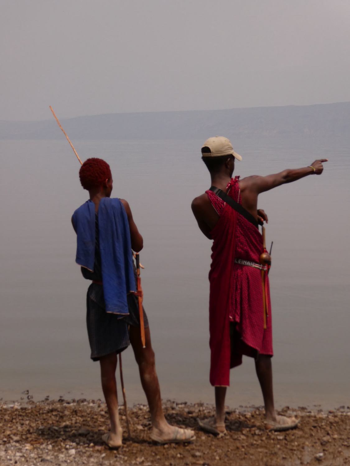 Two Maasai guides looking out over a Rift Valley lake